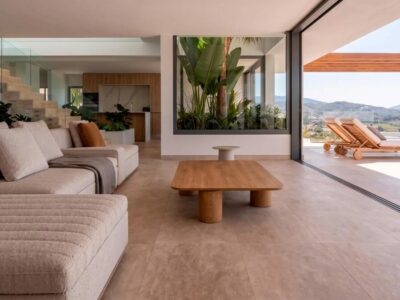 Living room opening onto a terrace with golf and sea views at Regia Villas, Valle Romano, Estepona