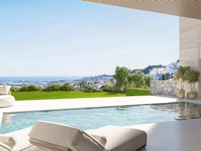 Pool and sun loungers on a terrace overlooking the coast at Altura Residences