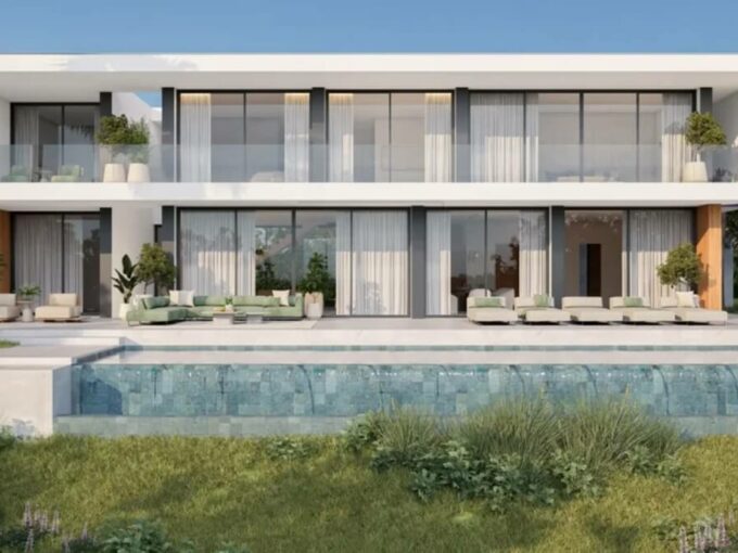 Rear of the villa with infinity pool and terraces at Villa Prana, Montemayor, Benahavís
