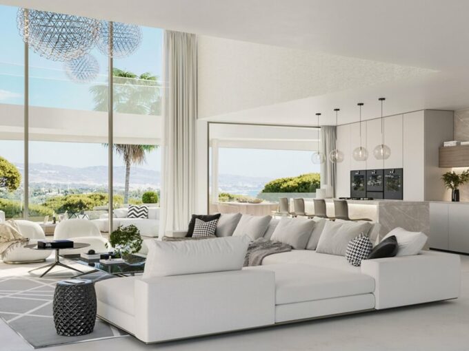 Salón abierto con cocina, grandes ventanales y vistas a la montaña en The Sky Marbella, Benahavís